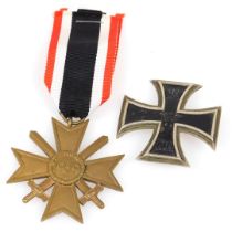 A WWI German Iron Cross First Class 1914, together with a WWII German War Merit cross. (2)