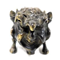 An early 20thC bronze inkwell, modelled as a grotesque, manner of Martin Brothers, 7cm wide.
