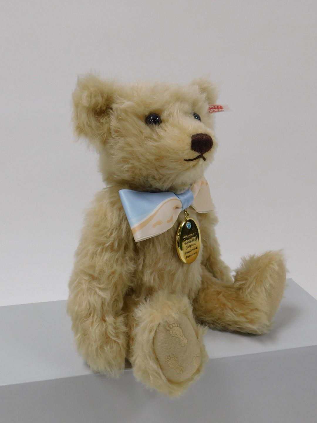 A Steiff Queen Elizabeth II memorial bear, number 6898, with certificate, and the Footprints in the - Image 5 of 5