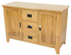 A small light oak sideboard, with three drawers and two panelled doors, on stiles, 119cm wide.