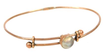 A Victorian blister pearl set bangle, in rose coloured metal, unmarked, 3.9g all in.