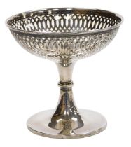 A George V loaded silver pedestal sweet meat dish, with pierced decoration, Chester 1911, 12cm high,