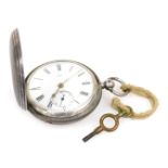 A Victorian silver cased hunter pocket watch, key wind, circular enamel dial bearing Roman numerals,