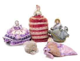 A group of early 20thC Gainsborough lady pin dolls, with cushion of fabric bases. (5)