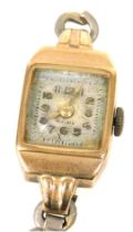 A mid century lady's 9ct gold cased wristwatch, square dial bearing Arabic numerals, fifteen jewelle