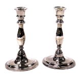 A pair of Regeny Old Sheffield Plate candlesticks, of baluster form, raised on an oval base, 24cm hi