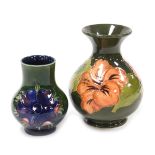 A Moorcroft pottery Anemone pattern vase, of baluster form, green ground, bears paper label, 10cm hi