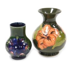 A Moorcroft pottery Anemone pattern vase, of baluster form, green ground, bears paper label, 10cm hi