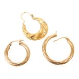 Two 9ct gold hoop earrings, and a further earring with embossed foliate decoration, 2.3g.