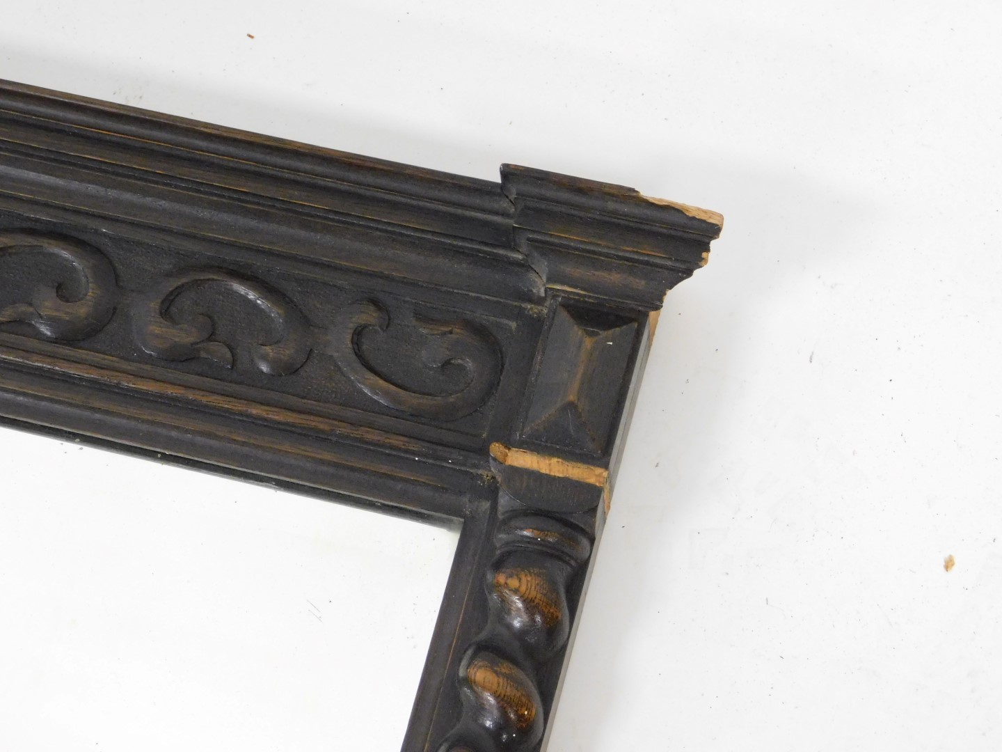 A 1920s oak wall mirror, inverted break front, moulded cornice above blind fret frieze and a bevelle - Image 3 of 4