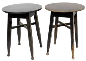 A pair of ebonised oak and laminate pub or cafe tables, in Art and Crafts style, each with a circula
