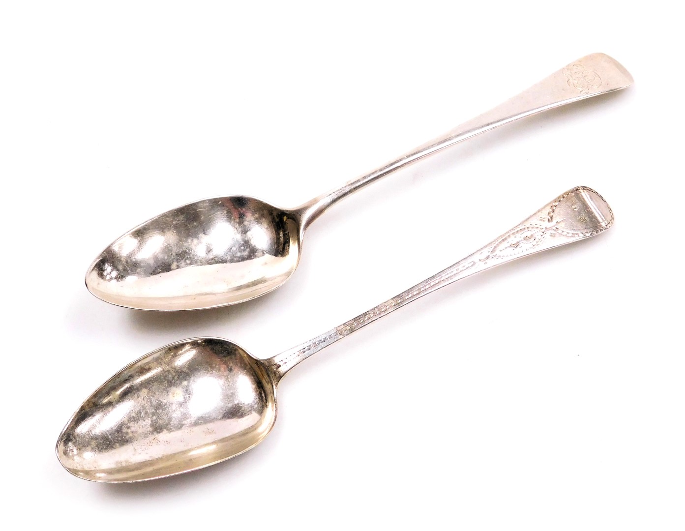 A George III Old English pattern tablespoon monogram engraved, London 1794, and a further tablespoon