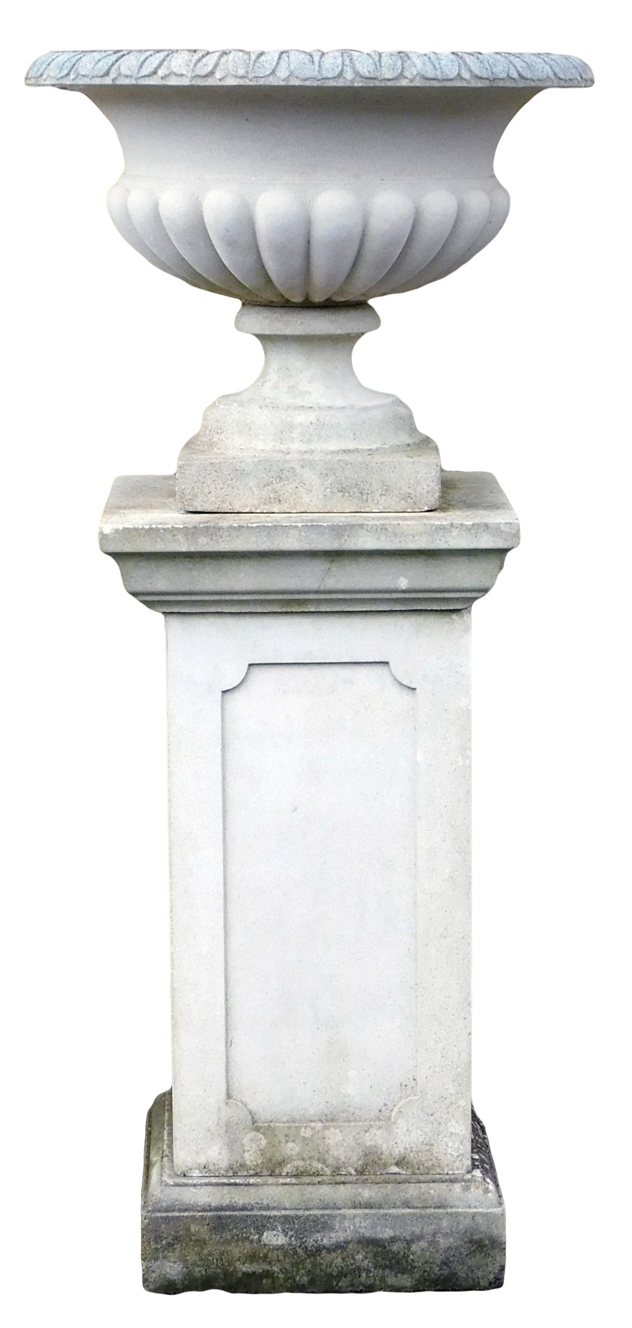 A reconstituted stone garden urn, of part fluted form, on a rectangular plinth with panelled sides,