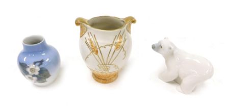 A Lladro porcelain figure of a polar bear, Fieldings Crown Devon pottery Art Deco vase, of twin hand