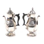 A pair of silver plated coffee pots, of octagonal baluster form, by Edward and Sons of Glasgow, 20cm