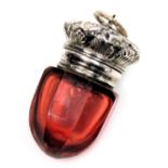 A Victorian cranberry glass vinaigrette with a hinged lid, and pierced grill, embossed with leaves a