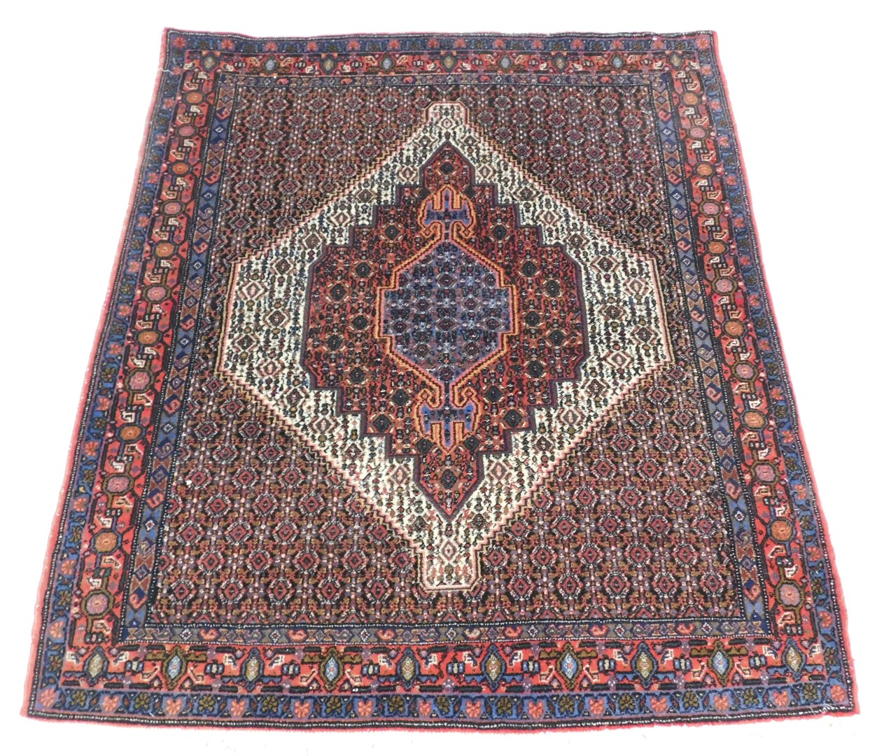 A Persian rug, with all over decoration of geometric devices, one wide and two narrow borders, 153cm