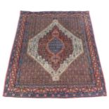 A Persian rug, with all over decoration of geometric devices, one wide and two narrow borders, 153cm