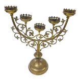 A Victorian Gothic brass altar candelabrum, of five branch form, with scrolling vines, raised on a c