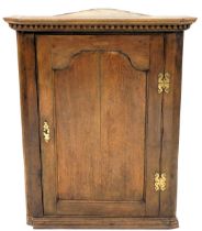 An early 19thC mahogany cabinet, singled panelled door, 92cm high, 73cm wide.