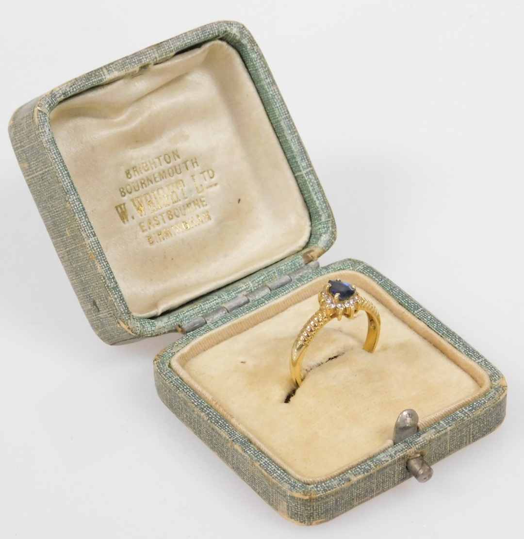 A lady's dress ring, set with a blue pear shaped stone, in a surround of white stones, in yellow met - Image 2 of 2