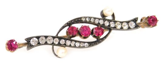 A Victorian ruby, diamond and seed pearl brooch, in a scrolling design, in white and yellow metal, 4
