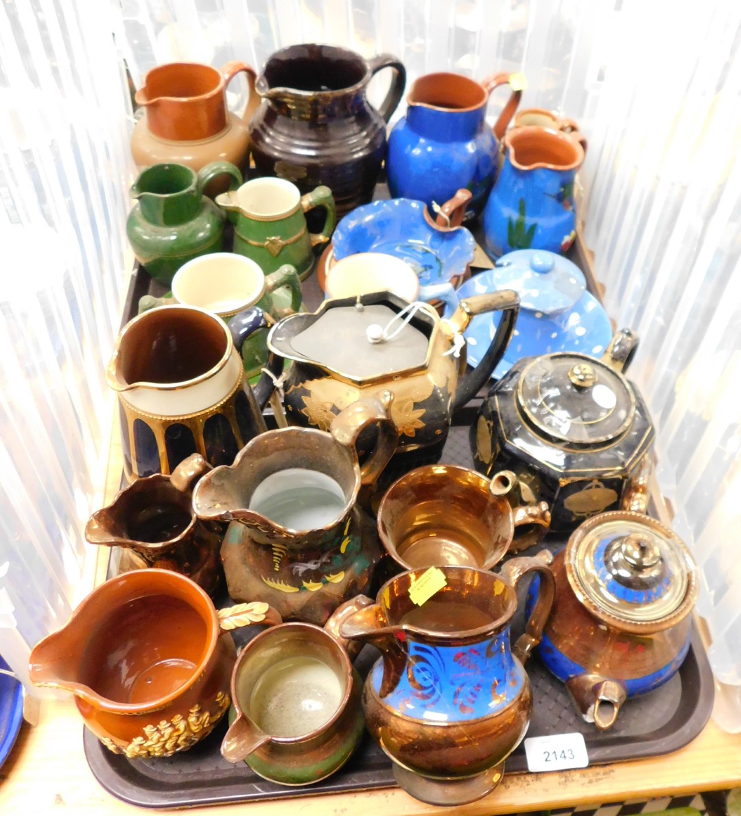 Ceramics in the form of Lustreware jugs, Mottoware jug and various other water jugs decorated in blu