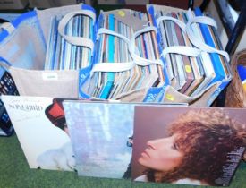 A quantity of LPs in three bags, titles including Barbra Streisand soundtrack to Songbird, Streisand