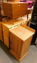 A small bleached oak pot cupboard, together with a needlework box, and a drop leaf kitchen table. (3