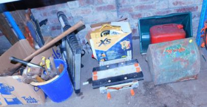 A selection of tools, including hammers, large pickaxe, spanners, etc., two bins for two lawn mowers