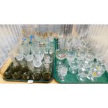 Glassware, including large etched glass drinking glasses, wine glasses, smoked glass tumblers, desse