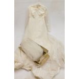A lady's wedding dress with veil, boxed.