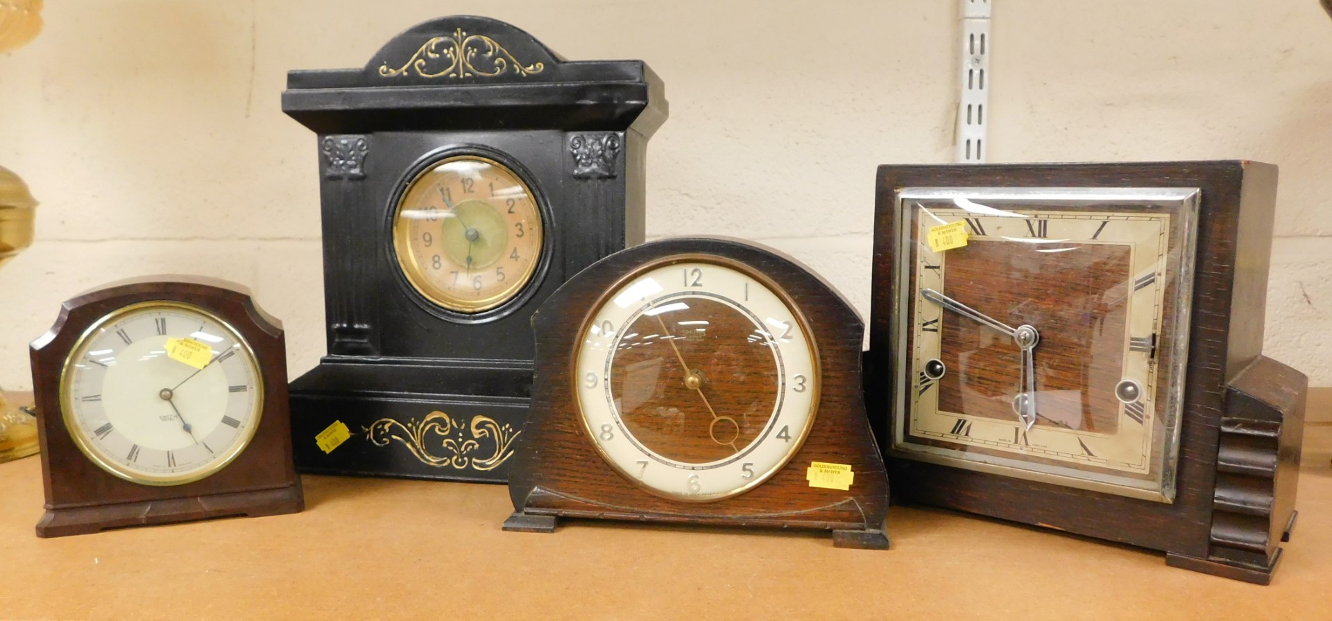 Four mantel clocks, one a Smiths eight day mantel clock, in an oak case, one a Bakelite cased Smiths