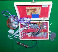 A jewellery box containing a quantity of necklaces, bangles, beads, rings, etc.