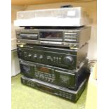 A stereo system including a Hitachi direct drive turntable, model HT-405, a Teknix compact disc play