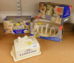 Lurpak collectibles, boxed, including a toast rack, egg cups and a butter dish with cover.
