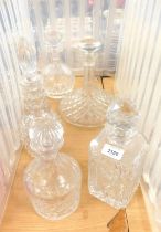 Decanters, one being a ship's decanter, the other cut glass, all with stoppers, the largest 24cm hig