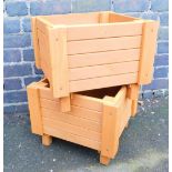 Two square hand built modern planters, wooden, stained brown, 33cm high, ;8cm, wide, 38cm deep.