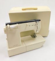 A cased Singer sewing machine circa 1960s.