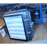 A steel cased dehumidifier.