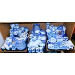 A large quantity of blue and white Willow pattern dinner wares, to include small bowls, small plates