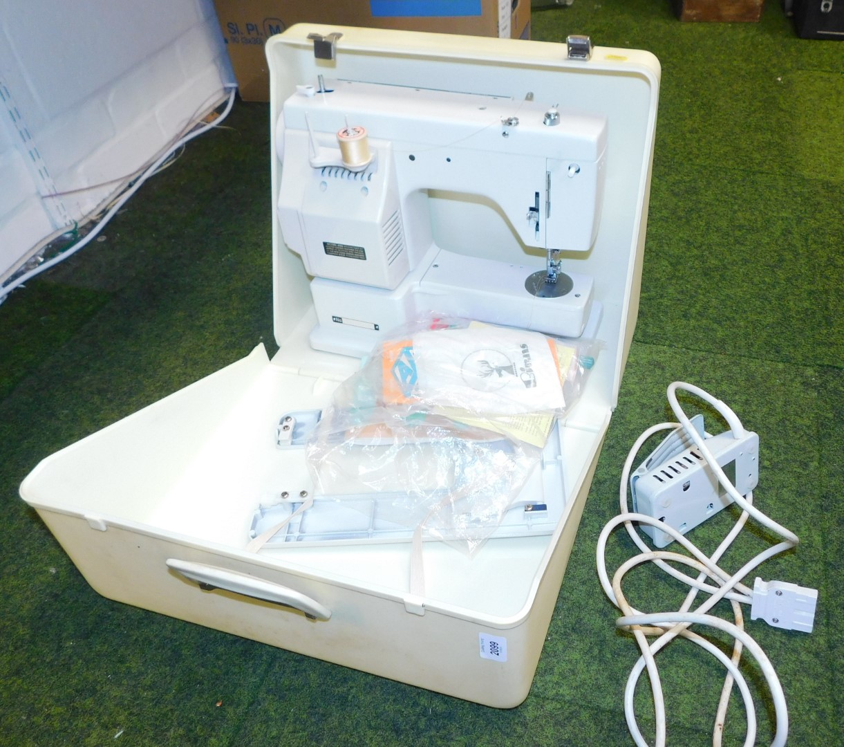 A Japanese sewing machine, cased, model number 696, manufactured by the Janome Sewing Machine Compan