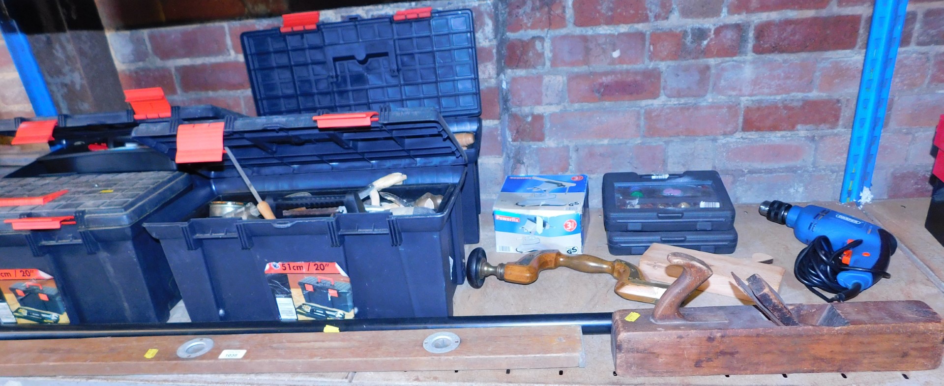 Four toolboxes containing various tools, mainly hand tools, chisels, spirit level, wood plane, hand