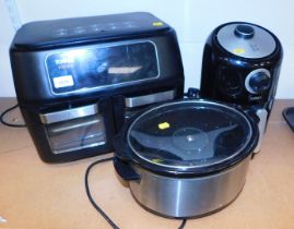 A Tower air fryer model T17102, a slow cooker and another Tower air fryer, model T17026.