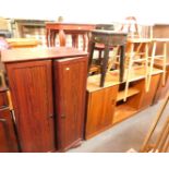 A two door cupboard, with shelves to interior, an ebonised plant stand or occasional table, carved w