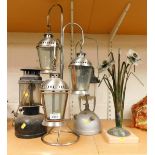 Various metal lanterns, and a sculpture in the form of flowers, the tallest lamp 44cm high.