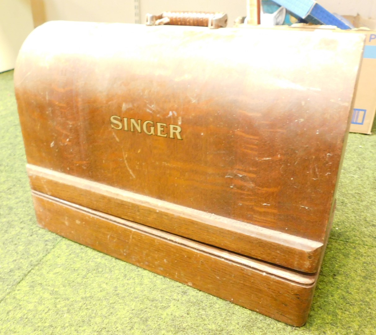 A Singer sewing machine, with case, no key.