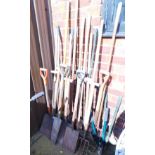 A quantity of garden tools, including spades, forks, hose, clippers, etc.