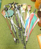 A large quantity of walking sticks, shooting sticks and umbrellas.