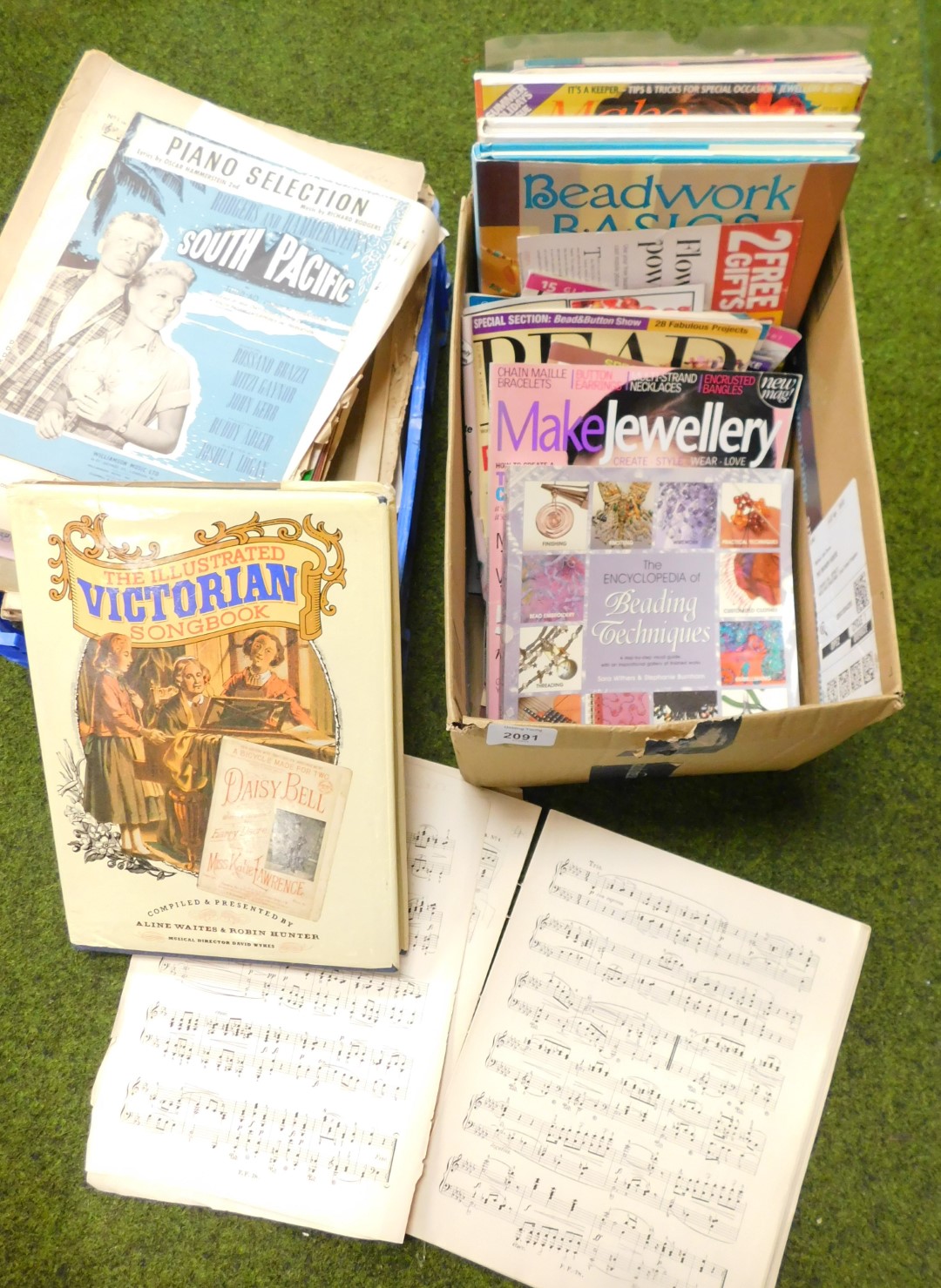 A quantity of sheet music and a quantity of needlework and jewellery magazines.